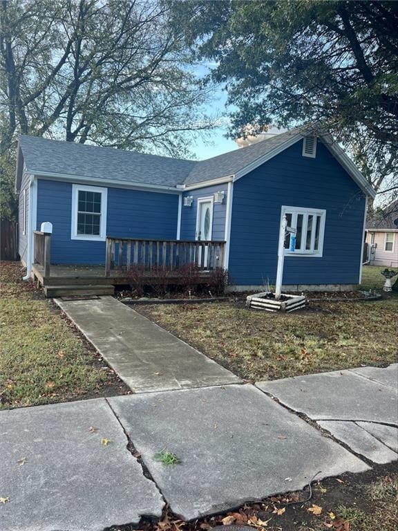 single story home featuring a deck