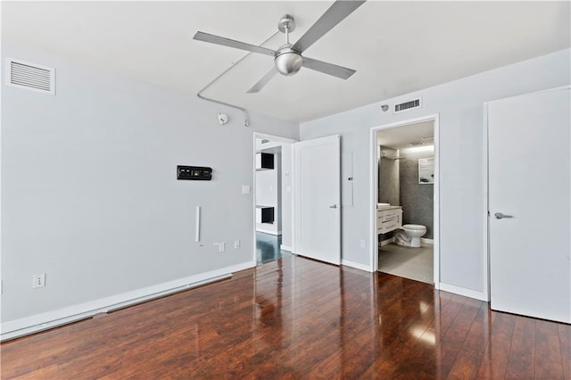 unfurnished bedroom featuring visible vents, connected bathroom, baseboards, and wood finished floors