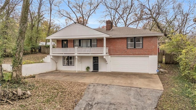 view of property featuring a balcony and a garage