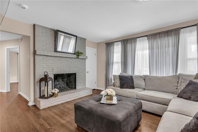 living room with a fireplace and hardwood / wood-style flooring