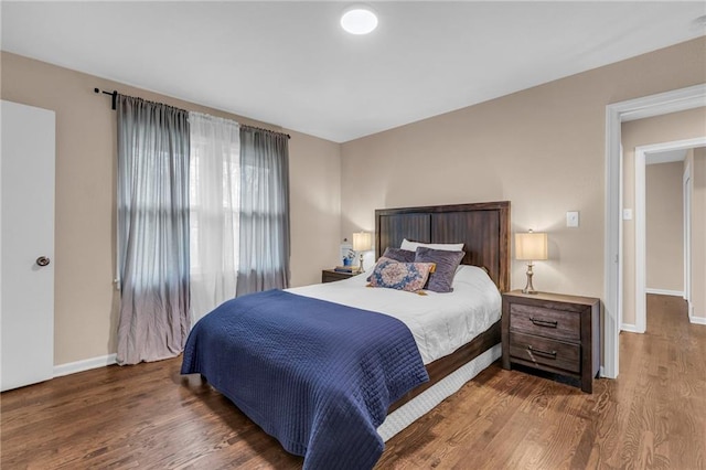 bedroom featuring dark hardwood / wood-style flooring