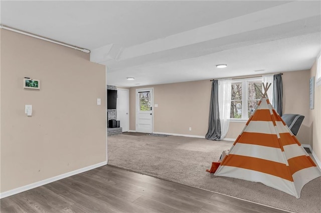 interior space featuring a wealth of natural light and dark hardwood / wood-style floors