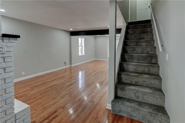 staircase featuring hardwood / wood-style flooring