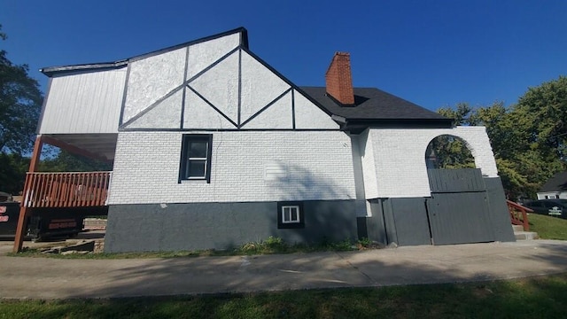 view of side of property featuring a deck