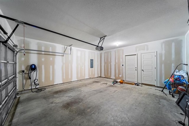 garage featuring a garage door opener and electric panel