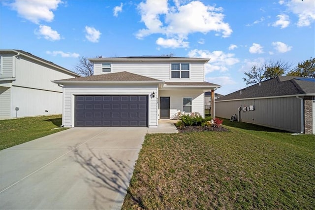 view of front property with a front lawn and a garage