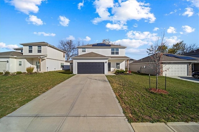 front facade with a front yard and a garage