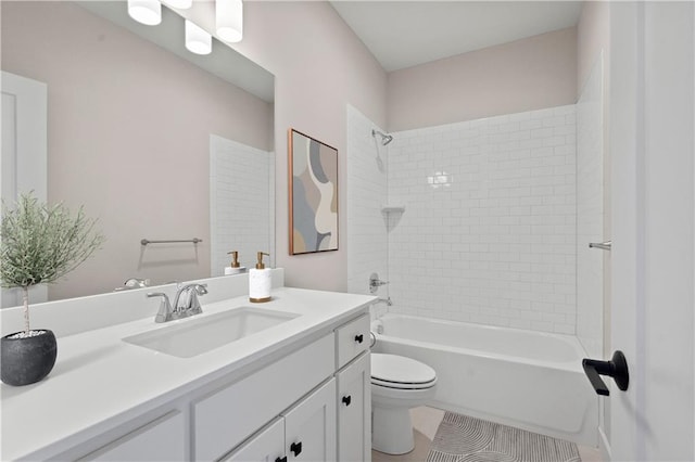 full bathroom featuring tiled shower / bath combo, vanity, tile patterned flooring, and toilet