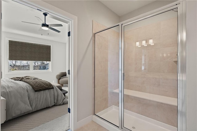 bathroom featuring ceiling fan and a shower with door