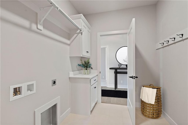 washroom featuring cabinets, washer hookup, and hookup for an electric dryer