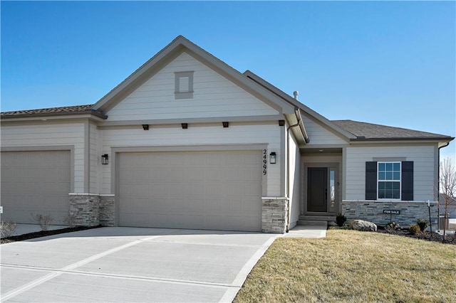 view of front of property with a garage and a front yard