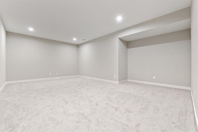 finished below grade area featuring carpet flooring and recessed lighting