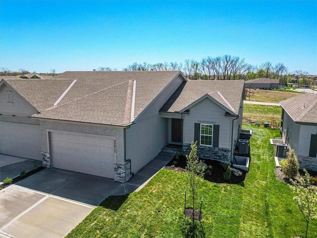 ranch-style home featuring a front lawn, driveway, stone siding, a shingled roof, and an attached garage