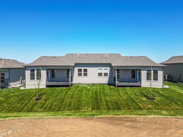 25015 W 94th Ter, Lenexa, KS 66227 - rear view of property with a yard and cooling unit
