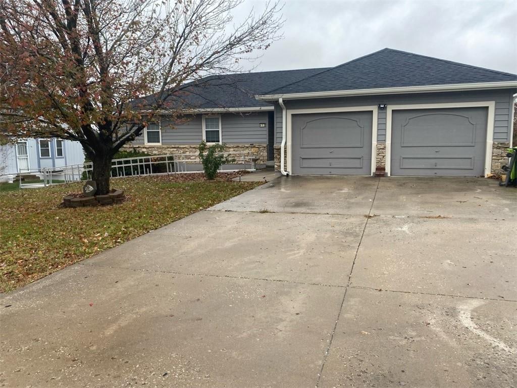 ranch-style house featuring a garage