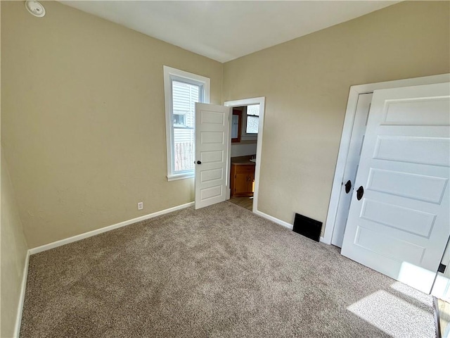 unfurnished bedroom with carpet flooring