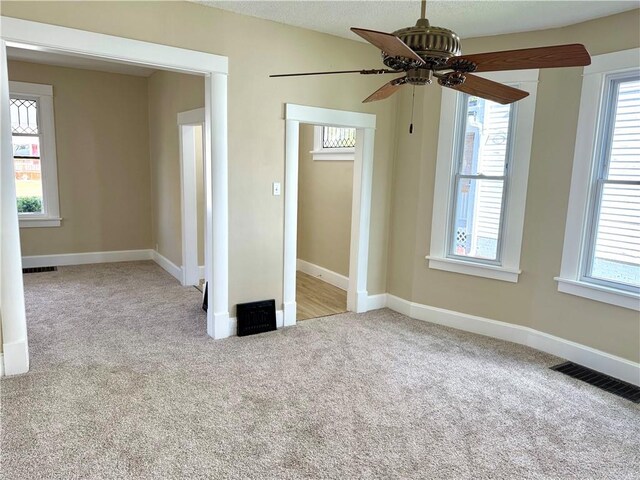 interior space featuring plenty of natural light and ceiling fan