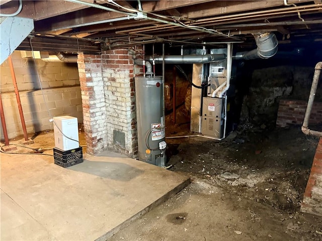 basement featuring heating unit and water heater