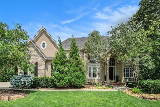 view of front of property with a front lawn