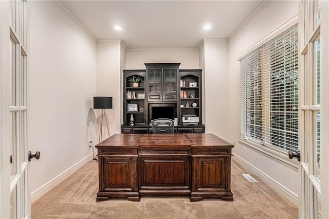 home office featuring ornamental molding and light colored carpet