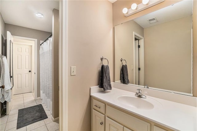 bathroom with vanity and tile patterned flooring