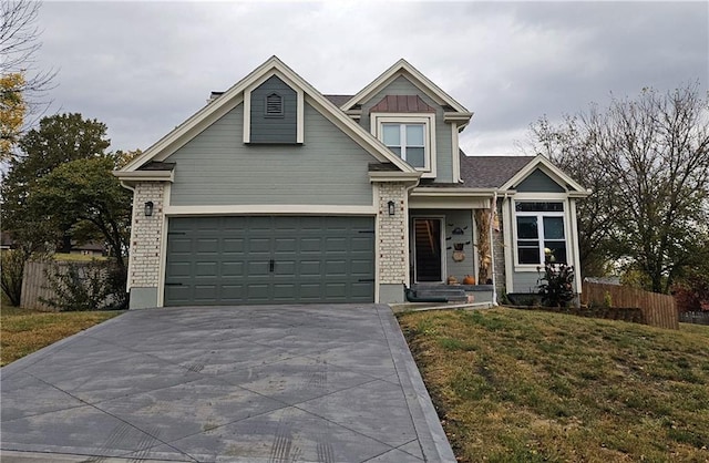 view of front of home featuring a garage and a front yard