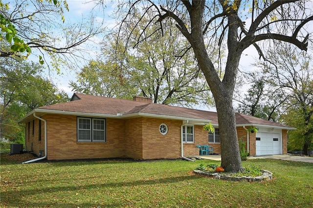 ranch-style home with a garage and a front lawn