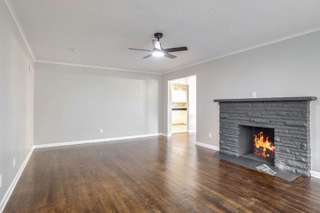 unfurnished living room with ornamental molding, dark wood-type flooring, and a fireplace