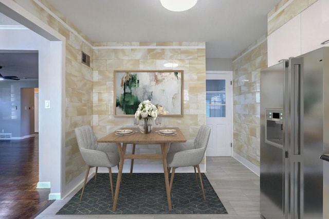 dining room with hardwood / wood-style flooring