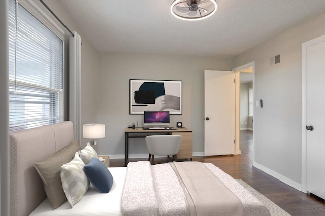 bedroom featuring dark wood-type flooring