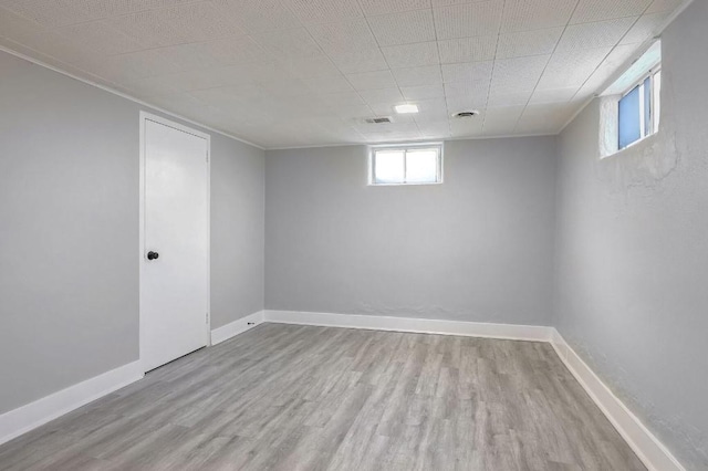 basement featuring light wood-type flooring