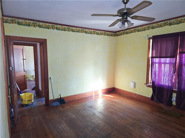 unfurnished room with crown molding, ceiling fan, and wood-type flooring