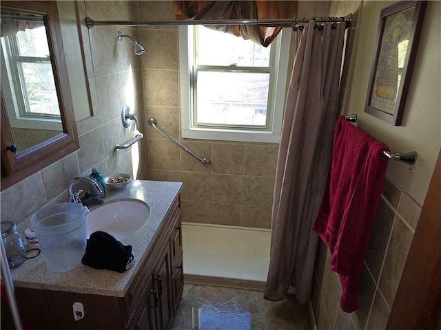 bathroom with vanity, backsplash, tile patterned floors, and curtained shower