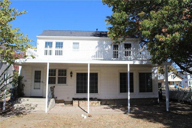 1201 W 4th St, Coffeyville, KS 67337 - back of house featuring a balcony