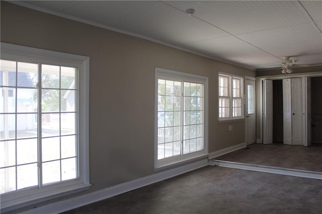 interior space with ceiling fan