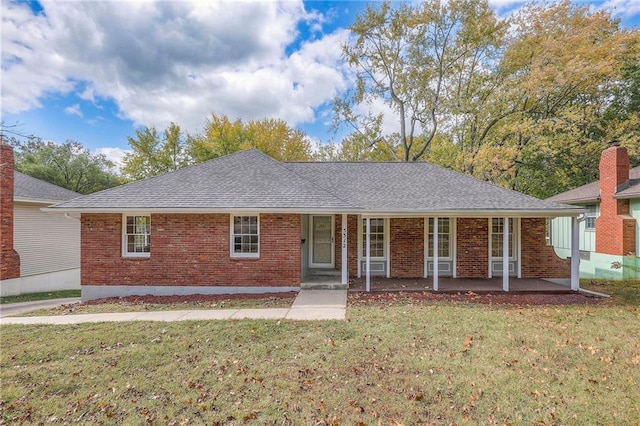 ranch-style home with a front lawn