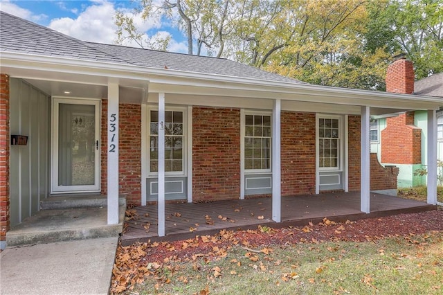 entrance to property featuring covered porch