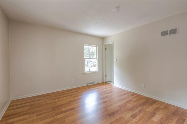 empty room featuring light hardwood / wood-style floors