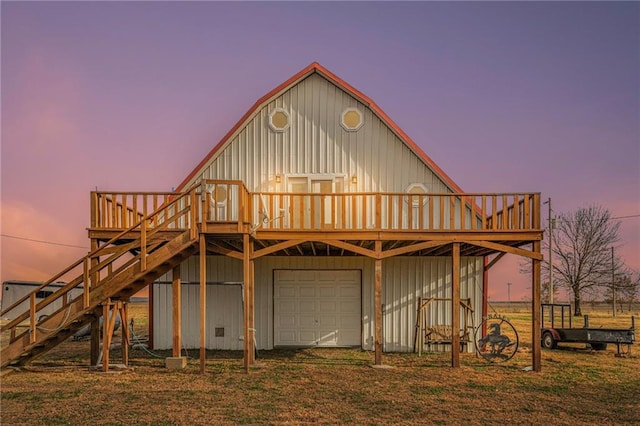 exterior space with a wooden deck and a garage