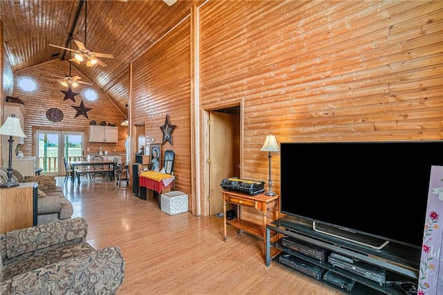 living room featuring light hardwood / wood-style floors, wood ceiling, high vaulted ceiling, and ceiling fan