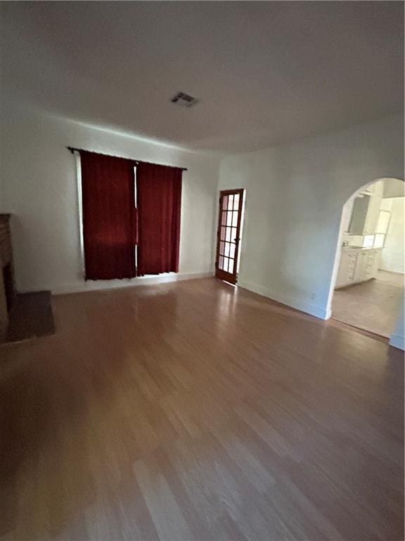 unfurnished living room with light wood-type flooring