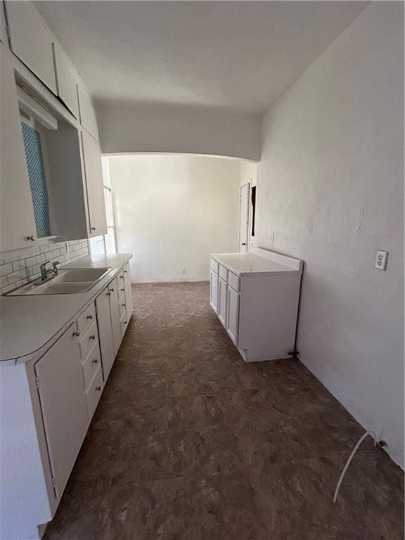 bathroom with vanity and tasteful backsplash