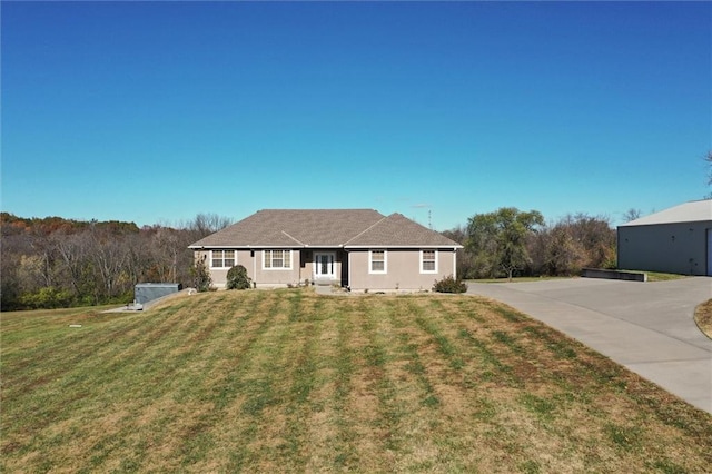 ranch-style house with a front yard