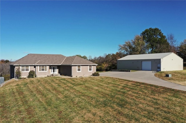 view of front of property with a front lawn and a garage