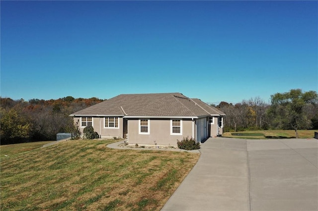 ranch-style house featuring a front lawn and a garage