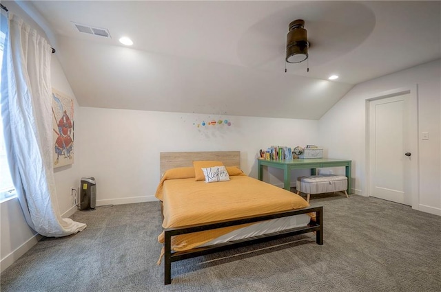 carpeted bedroom featuring visible vents, vaulted ceiling, baseboards, and ceiling fan