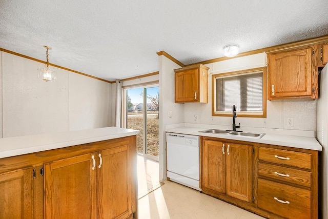 kitchen with a textured ceiling, dishwasher, sink, and pendant lighting