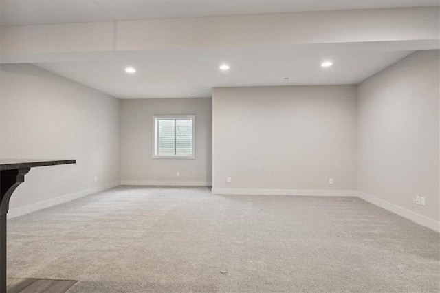 unfurnished living room with light carpet