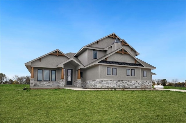 craftsman-style house with a front yard