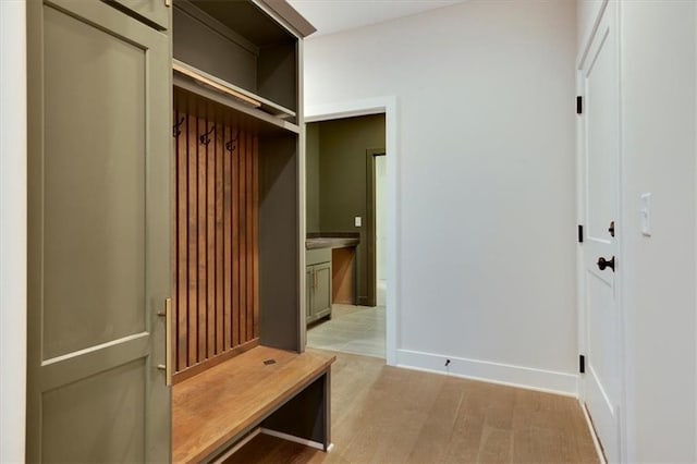 mudroom with light hardwood / wood-style floors